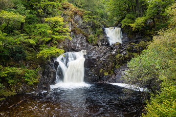 shot of Eas Chia-Aig waterfalls in Glen Chia-Aig near Achnacarry, Gairlochy and Fort William in the argyll region of the highlands of Scotland during autumn after heavy rainfall