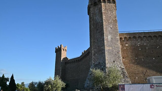 Montalcino, Tuscany, Italy. August 2020. The imposing medieval castle takes us back to the past, pentagonal base with towers on the corners.