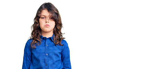 Cute child with long hair wearing casual clothes depressed and worry for distress, crying angry and afraid. sad expression.