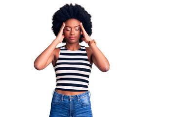 Young african american woman wearing casual clothes suffering from headache desperate and stressed because pain and migraine. hands on head.