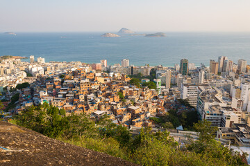 Obraz premium Elevated View of Slums on the Hill and Ipanema District Below With an Ocean in the Horizon in Rio de Janeiro, Brazil