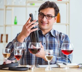Professional sommelier tasting red wine