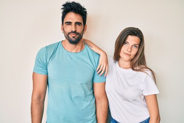 Fototapeta premium Beautiful young couple of boyfriend and girlfriend together looking sleepy and tired, exhausted for fatigue and hangover, lazy eyes in the morning.