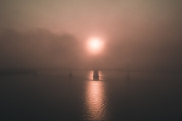 Naklejka na ściany i meble Gloomy apocalyptic sunrise over Bay Bridge in San Francisco