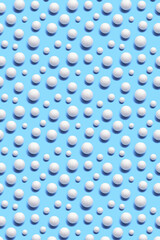 Creative pattern with white New years snowballs. Christmas greeting card with many snow ball on blue.