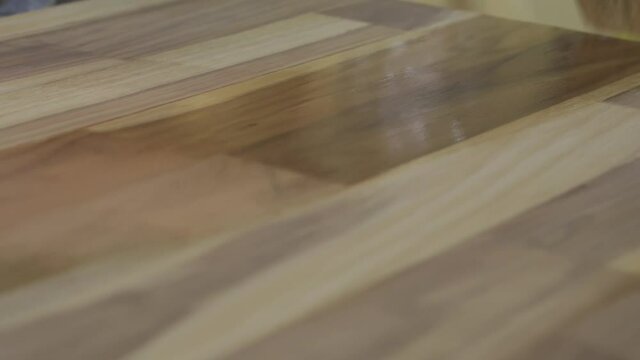 Stainer Being Applied to Wood Panel