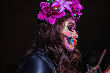 portrait of woman wearing a Dia de muertos makeup