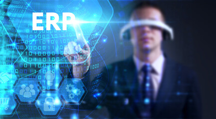 Business, technology, internet and network concept. Young businessman thinks over the steps for successful growth: ERP © Egor