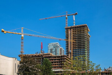 Construction of new high-rise buildings in Coquitlam City, industrial construction site,...