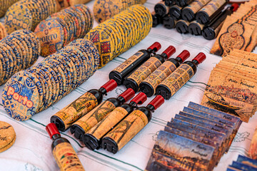 Souvenirs made with cork wood and Portuguese ornate azulejo pattern on display at a shop in Porto...