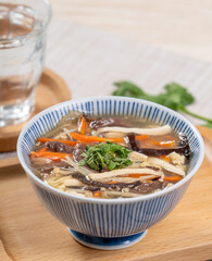Taiwanese food - Homemade delicious Hot and Sour Soup in a bowl on a serving tray.