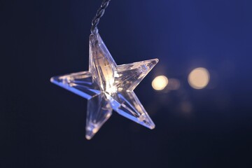 Christmas New Year Holidays Background.New year card. shining  star  on dark blurred...