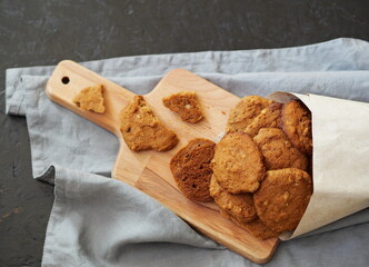 Vegetarian diet healthy food. Oatmeal cookies with whole grain rye flour in a paper bag.