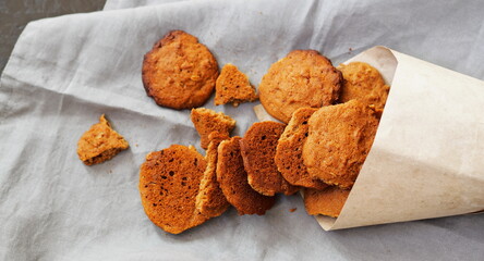 Vegetarian diet healthy food. Oatmeal cookies with whole grain rye flour in a paper bag.