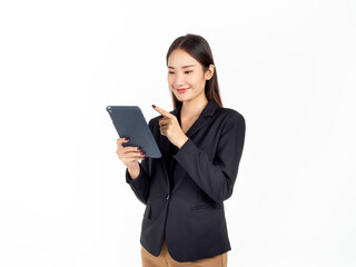 Fototapeta premium Portrait of young beauty Asian Businesswoman in black suit holding and using tablet.