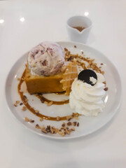 Ice cream trays and cups of honey in an ice cream shop