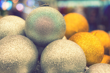 Golden Christmas balls, Christmas toys. Christmas tree decoration toys. Christmas concept. toned