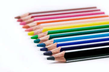 Fototapeta premium colored pencils row on white background