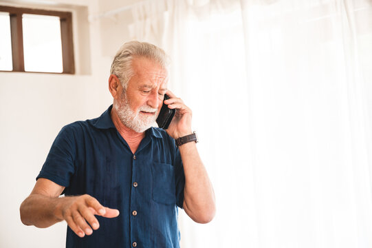 Caring Retired Father Calling His Children For Tele Communication At Home