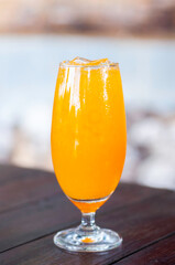 Fresh orange juice serve in nice glass lay on wooden table, refreshment beverage high vitamin.
