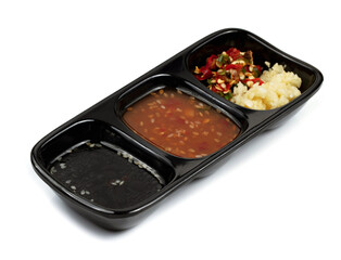 Set of slice vegetable, garlic, and chilli on black tray for topping sauce in shabu style  isolated...