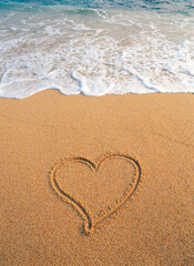 Fototapeta na wymiar heart shape on sandy beach