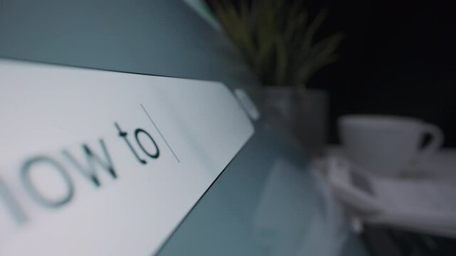 Motorized moving shot of searching for money saving tips on the Internet, shot with macro probe lens