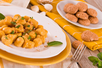 Pumpkin gnocchi with grated amaretti cookies.