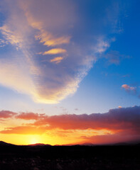 billowing clouds and sunset