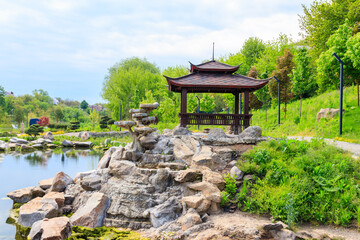 Beautiful japanese gazebo by a pond in Japanese garden