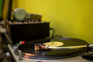 Close-up of the record player. Sound console and headphones