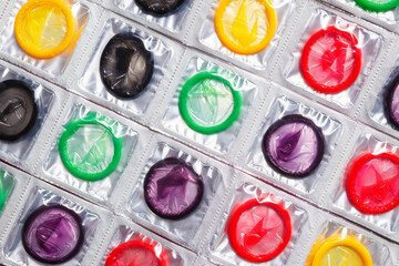 Colorful condoms background.