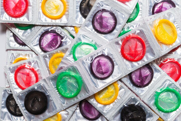 Colorful condoms background.