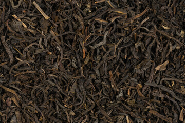 Dried tea leaves background texture. close-up