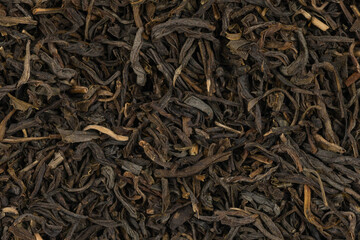 Dried tea leaves background texture. close-up