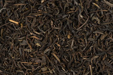 Dried tea leaves background texture. close-up