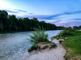 River Isar bank or coast line in downtown Munich, Germany during twilight sunset