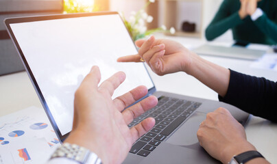 team of businessmen are summarizing the profits of the company to make bonuses for employees.