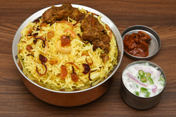 Chicken biryani. Spicy Indian Malabar biryani or Hydrabadi biryani, Dum Biriyani,  fish and rice. pulao basmati rice, spicy mixed rice dish with meat curry for Ramadan Kareem, Eid