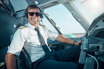 Smiling handsome pilot enjoying his work in aircraft © Svitlana
