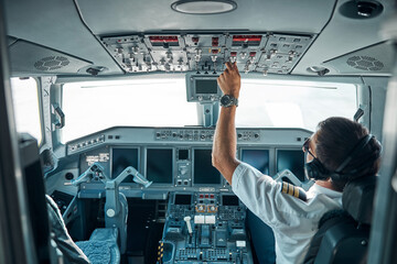 Male professional getting ready for taking off jet