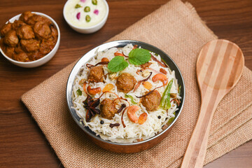 Veg biryani or soya biryani. Spicy Indian Malabar biryani or Hydrabadi biryani, Dum Biriyani, pulao, pulav, pilaf, basmati rice, spicy mixed rice dish with meat curry for Ramadan Kareem, Eid