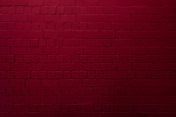 Fototapeta na wymiar Red brick wall background with shades of light and dark crimson