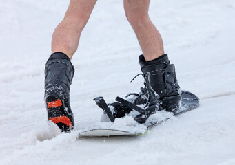 Snowboarder rides in the snow.