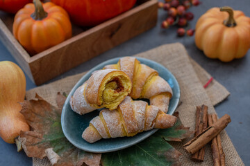 Sweet home made pumpkin crescent rolls on a table