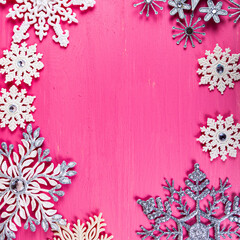 Christmas. Snowflakes on a wooden background. Frame.