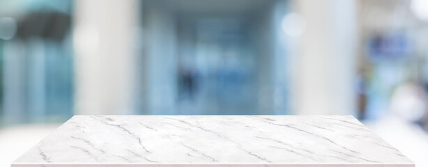 marble table background with blur business office hallway entrance.banner mockup for display of...