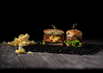 Vegan Juicy Lucy beyond burger on a dark background.