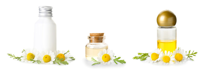 Bottles of cosmetic products with chamomile flowers on white background