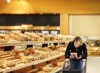 Choosing food from shelf in supermarket,bakery,Grocery stores
